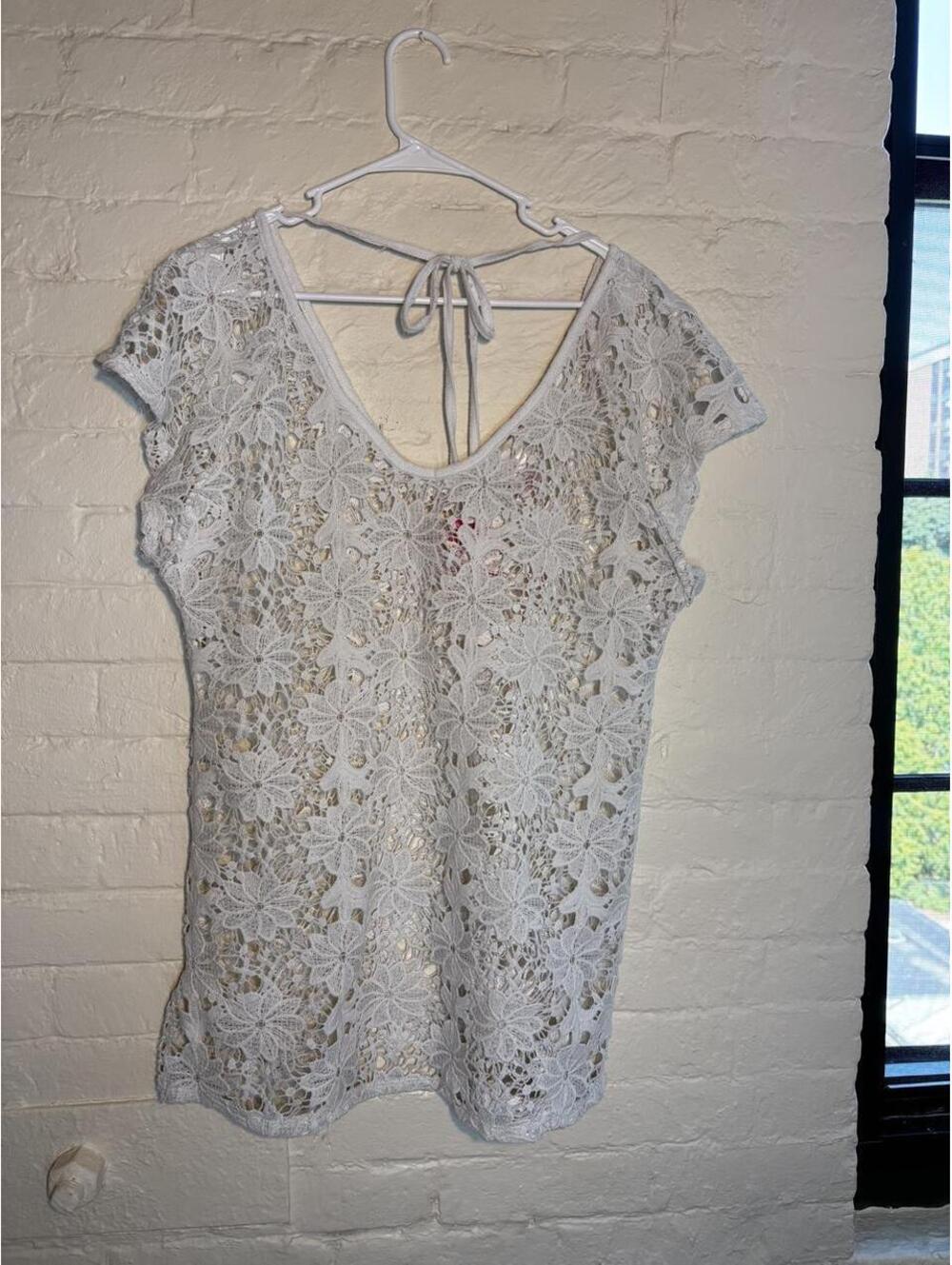 White lace blouse with floral design